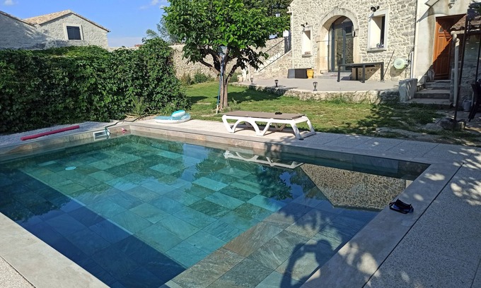 Fontanes House | Stone house renovated in a contemporary style with garden and swimming pool.