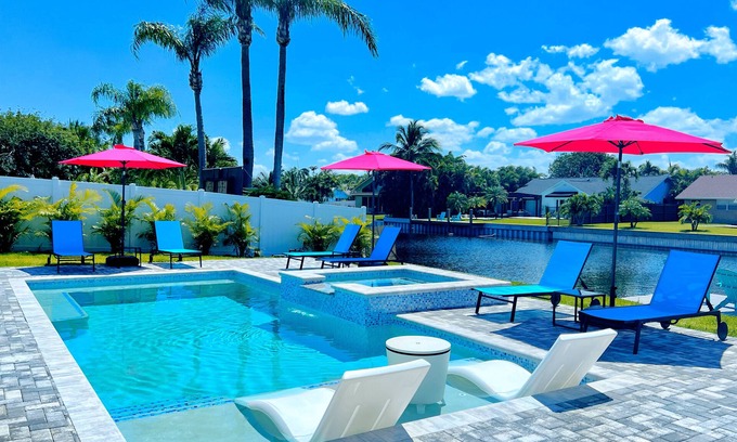Tropic Palms House | Stunning Delray Waterfront Oasis Heated Pool, Spa, Canal, Huge Patio, Pool Table