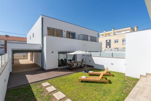 Senhora da Hora House | Stylish Home w/Garage & Terrace by HostWise
