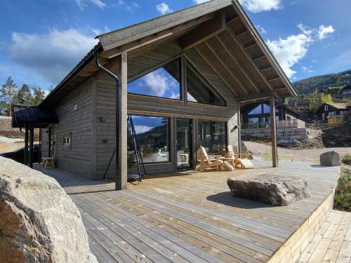 Kviteseid House | Stylishly furnished chalet with a large terrace in Vrådal