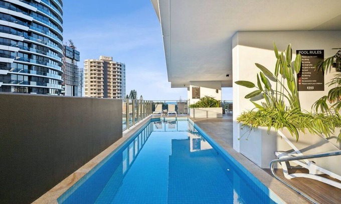 Gold Coast Apartment | Sun-Kissed Coastal Comfort | Pool Gym Beach BBQ