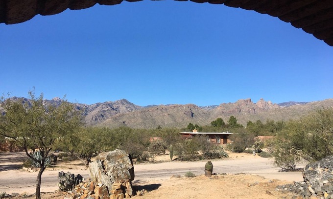 Tres Lomas North House | Sun-kissed foothills home with stunning mountain views and heated pool.
