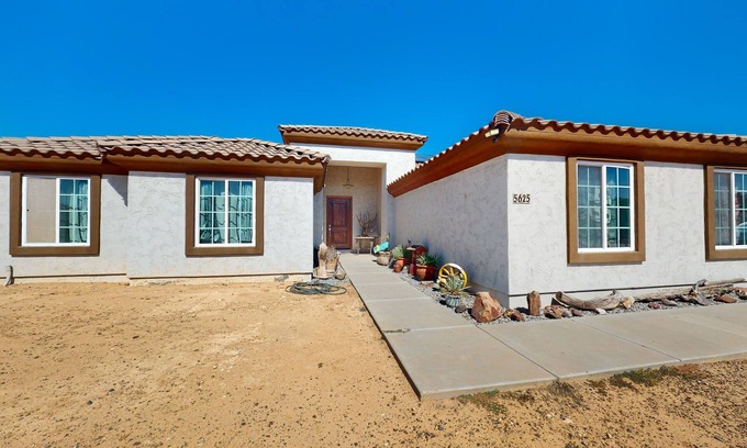 Estrella Village House | Sunny home with great backyard, home office, gym & convenient location