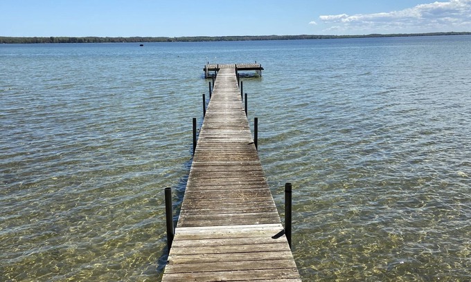 Mullett Lake House | Sunrise on Mullett Lake, 115' Lakefront sandy bottom, private dock, new remodel