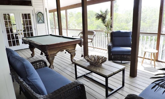 Palm Island House | Sunset Gulf views from your porch with a private dock.