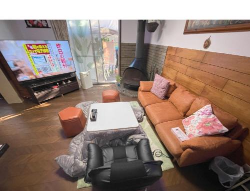 Edogawa House | Tatami room & Living Room equipped with Multinational TV and Fire, BBQ corner in Tokyo Downtown House