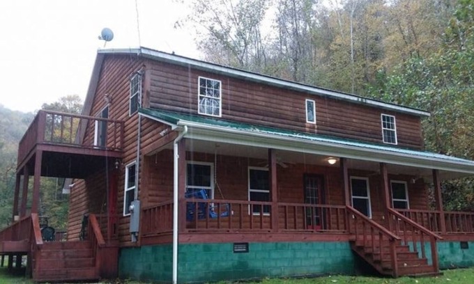 Fort Gay Cabin | The Bunkhouse A two story rustic cabin 3BR 2BA