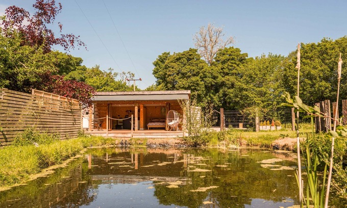 Carlisle Cabin | The Chard with hot tub overlooks a wildlife pond sleeping 2