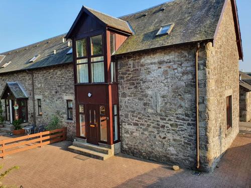Biggar House | The Granary at Tinto Retreats, Biggar is a gorgeous 3 bedroom Stone cottage