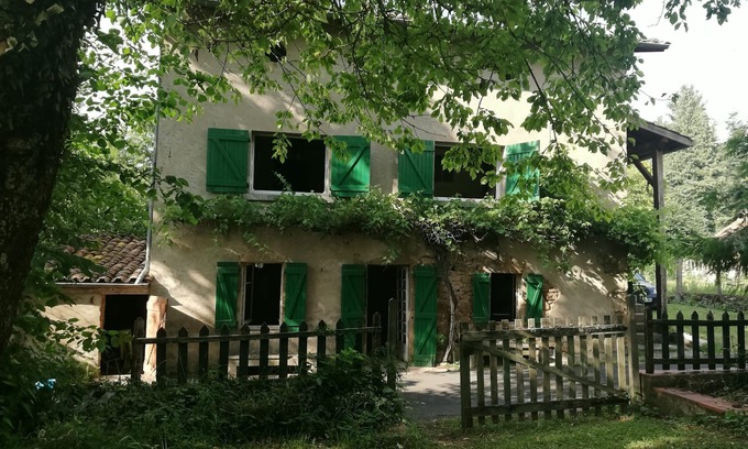 Chameane House | The house with the green shutters