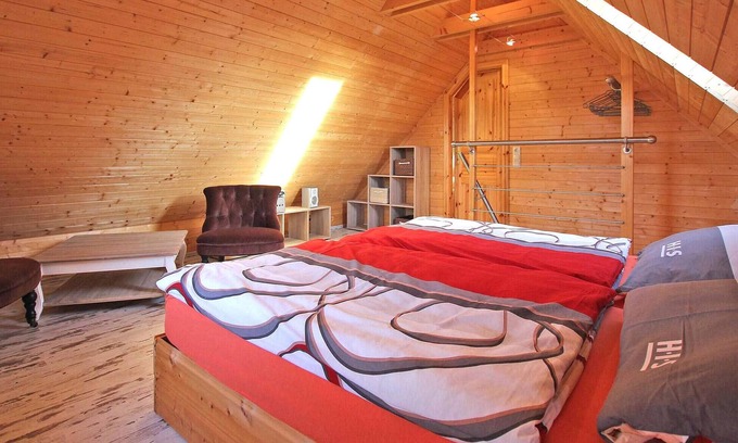 Kleinzerlang House | The log cabin-style holiday home for up to 4 people is located on the owners' approx.