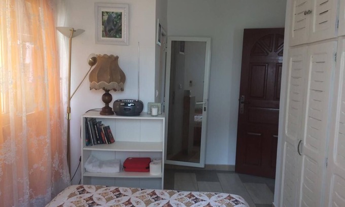 Libreville House | The unique experience of the " Gabon Gray Parrot sleeping room "