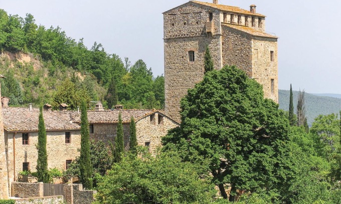 Stigliano Apartment | This apartment is located in a historic tower in the Castello del Poggiarello, a beautiful and chara