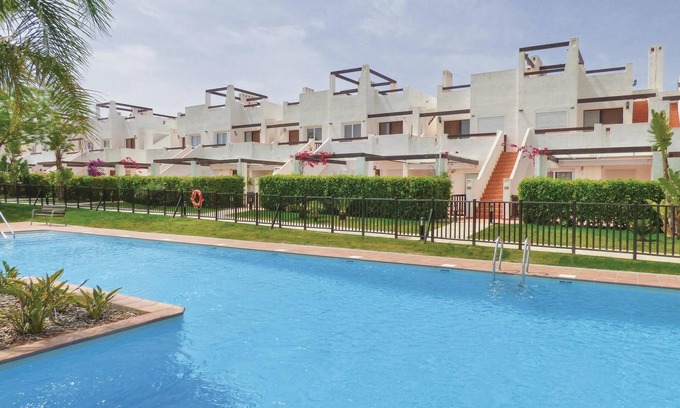 Alhama de Murcia Apartment | This beautiful apartment is located in a quiet corner of a resort complex with a communal pool and o