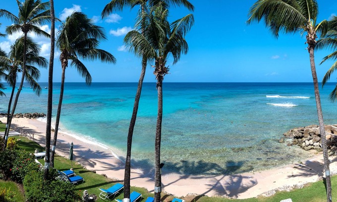 Reeds Bay Condo | This Penthouse is situated directly on a beautiful sandy beach and has a wonderful roof deck terrace