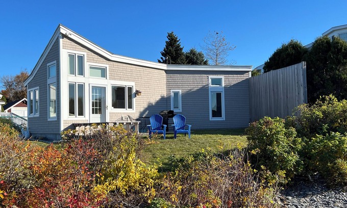 Mid-Coast and Islands Cottage | This sweet cottage offers a shared pebbly beachfront and gorgeous sunset views