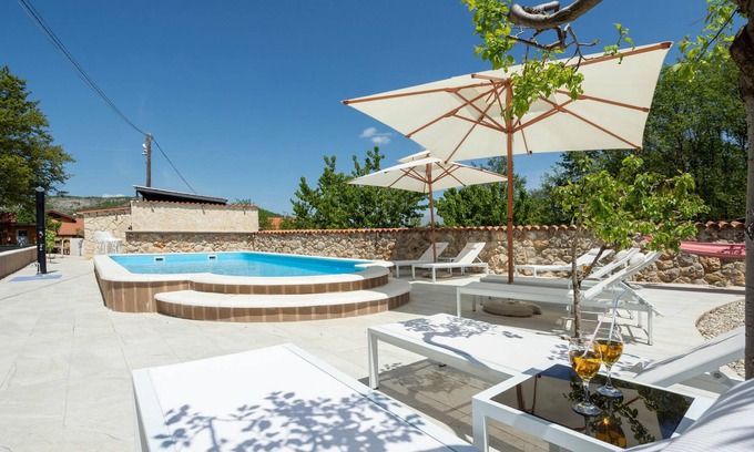 Vrlika House | This vacation home with pool offers you a pleasant stay with views of the mountains and nature.