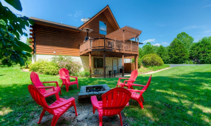 Livingston House | Three-story dog-friendly home with large deck, wood swing, firepit, lawn, & more