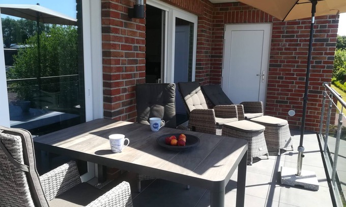 Wangerland Apartment | "Time out by the sea" ; Luxurious vacation apartment, close to the beach with a view of the countryside