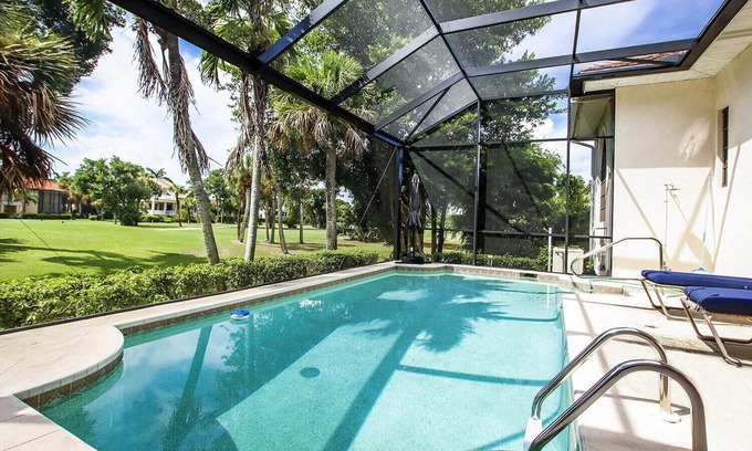 Beachview Country Club Estates House | Tin Cup - Beachview Estates home with pool on golf course