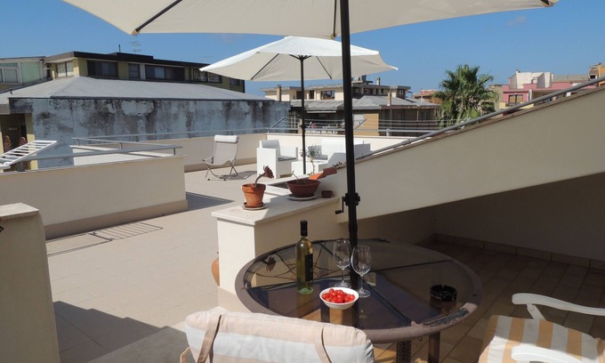 Oristano Apartment | Top floor penthouse apartment with terrace in the historical center, 3 km from the beach