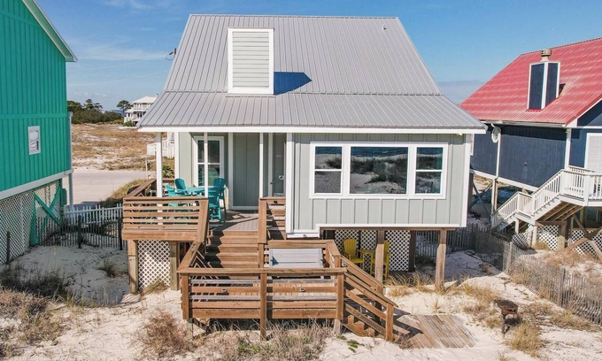 Fort Morgan House | Totally renovated 4 bedroom, 3 bath gulf front home with nice covered deck and large sun room.