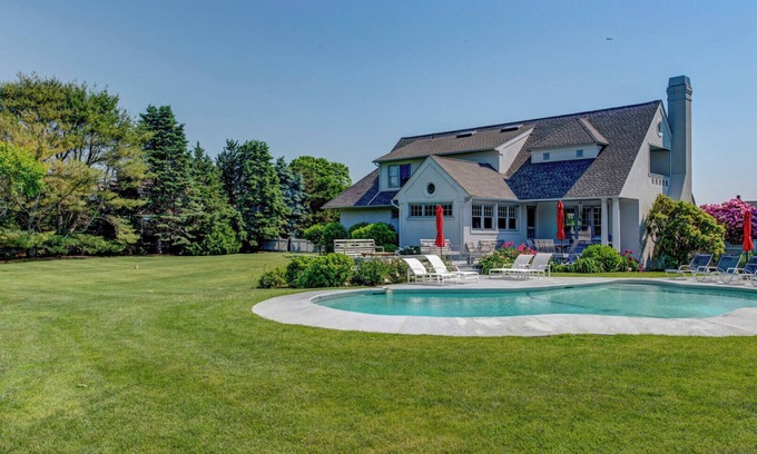 Water Mill House | Traditional-style home with private pool, sweeping back deck, grand lawn,.