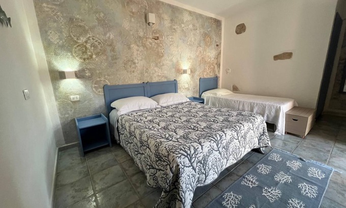 Gonnesa Apartment | Triple room with shared pool and kitchen, Wi-Fi and air conditioning
