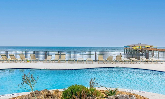 Daytona Beach Shores Apartment | Tropical Palms Partial Ocean View Pool Hot Tub