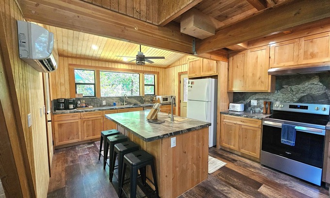 Sierra Cedars Cabin | Tucked in the trees, Cedar Hill is a cozy A-frame cabin with modern updates, a spacious kitchen, wraparound deck, and stunning views. The perfect mountain escape for families, couples, and friends—plus, it's pet-friendly!