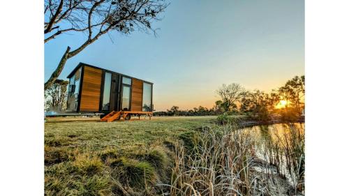 Burrum River House | Turtle Island Lakeside Tiny House by Tiny Away