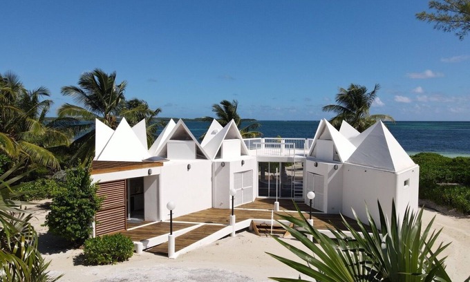 Winding Bay House | ULTRA LUX Coconut Cove Compound! 2.5 acres with 300 ft PINK SAND BEACH