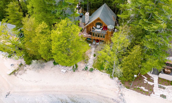 Suttons Bay Cabin | Unforgettable Log Cabin Experience: Family-owned, Lakefront, Private Beach