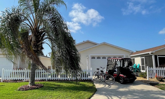 Sabal Chase House | Unwind in a sun-kissed retreat with luxe lounging and serene outdoor charm.