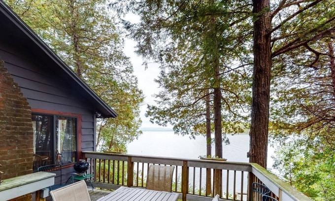 Charlotte Cottage | Updated lakefront home in a wooded setting with private dock & beach access