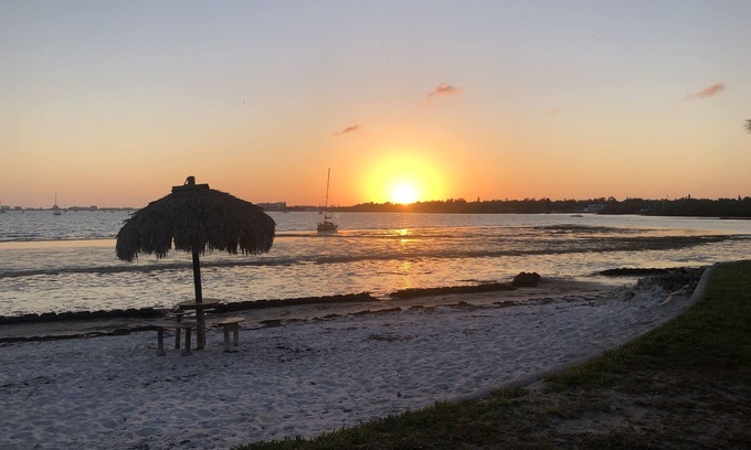 Bayview Condo | Upgraded Waterfront Condo Steps Away From Private Beach with Spectacular Sunsets