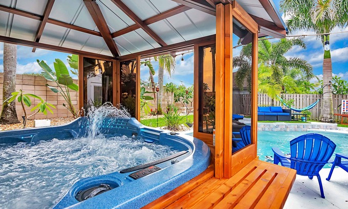 Tropic House | Urban Oasis W/hot Tub, Heated Pool And Private Movie Theater 2 Bedroom Home by RedAwning