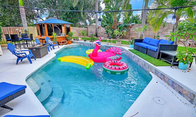 Tropic House | Urban Oasis w/Hot Tub, HEATED POOL and Private Movie Theater by RedAwning