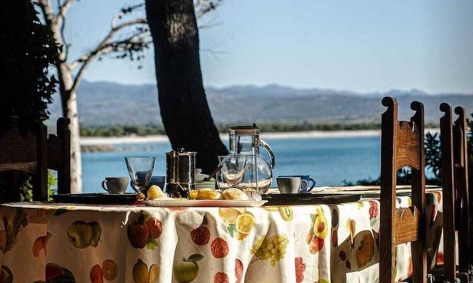 Porto Pino Villa | Vacation Home 'Fronte Mare Al Porticciolo' with Sea View, Barbecue Area & Wi-Fi