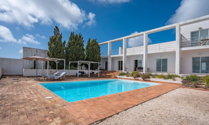 Aljezur Villa | Villa 'Alto Da Lua' with sea view, shared pool and Wi-Fi access
