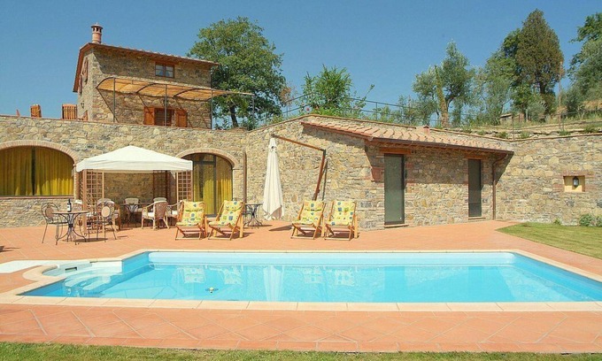 Gaiole in Chianti Villa | Villa Eracle: A bright and elegant three-story villa surrounded by vineyards and olive groves.