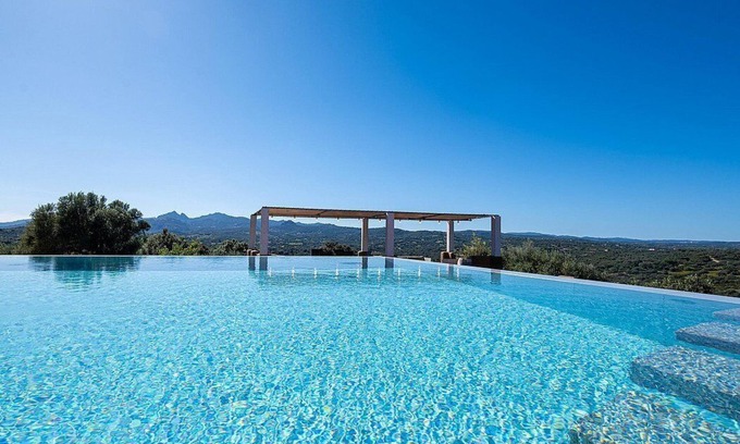 Arzachena Villa | Villa Zirima: A characteristic and welcoming two-story villa surrounded by the greenery, with Free WI-FI.