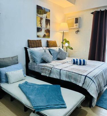 Phil-Am Apartment | Vinia Infinity Studio 2 Near Malls with WiFi Netflix and Karaoke