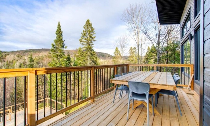 Sainte-Beatrix Ski Chalet | Vulcano Sauna and Spa, modern chalet with water access.