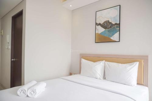 Ciputat Apartment | Warm and Minimalist Studio Transpark Bintaro Apartment By Travelio