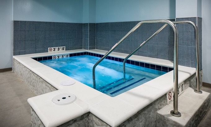 Historic East Village Condo | Warm and Welcoming Suite | Free Breakfast, Indoor Pool + Hot Tub