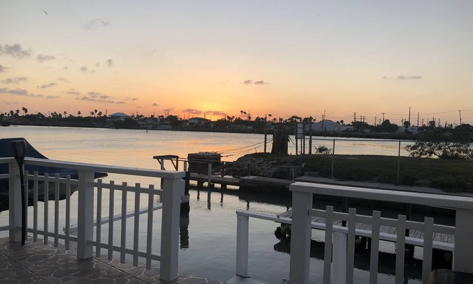 Port Isabel Cottage | Waterfront 1BR 2 bed in Long Island Village; Watch for Dolphin from the deck!