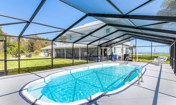 Tropic House | Waterfront Beauty: Sleeps 15, Heated Pool, Private Dock, Near Beach
