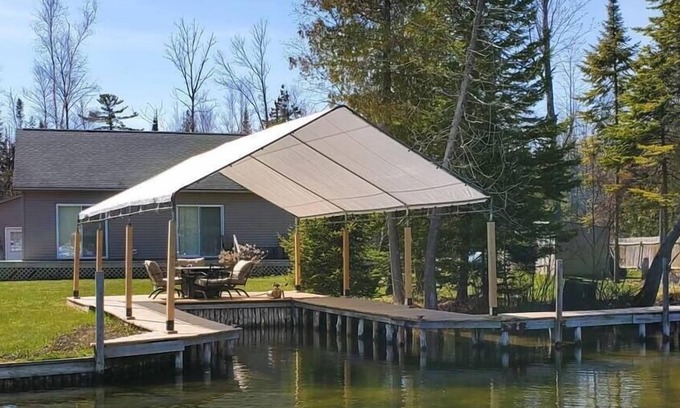 Alanson House | Waterfront Cottage with Covered Boat Slip