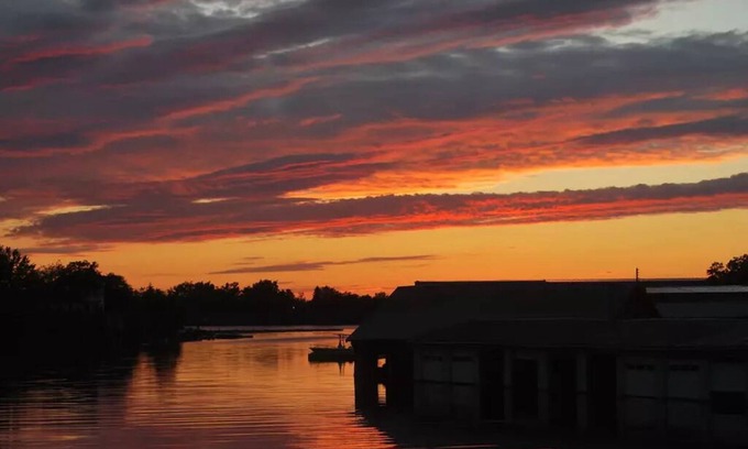 Alexandria Bay House | Waterfront Home with dock and a sunset view